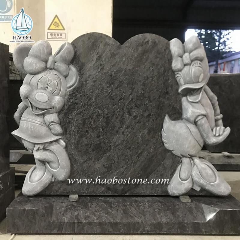 バハムブルーの花崗岩の漫画のミニーマウスとデイジーダックの墓石
