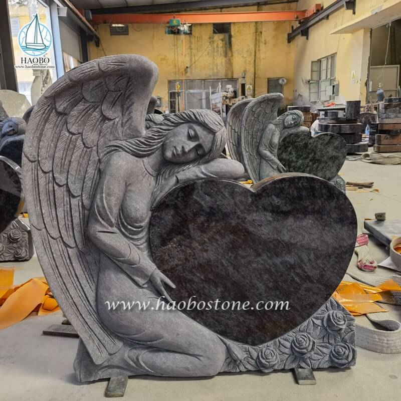 バハマ ブルーの花崗岩の天使保持ハート彫刻墓石
